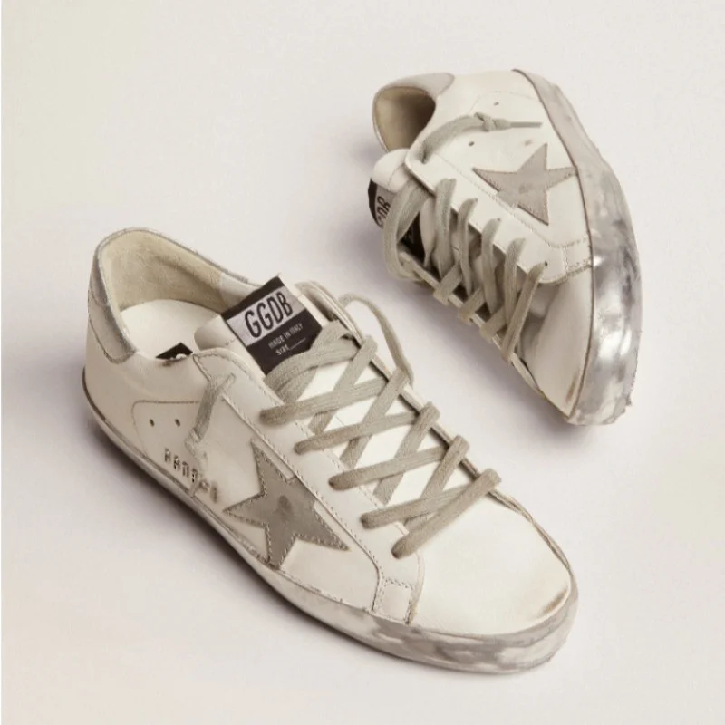 Golden Goose Women's Super-Star Sneakers with Silver Sparkle Foxing and Metal Stud Lettering 5 Golden Goose Women's Super-Star Sneakers with Silver Sparkle Foxing and Metal Stud Lettering
